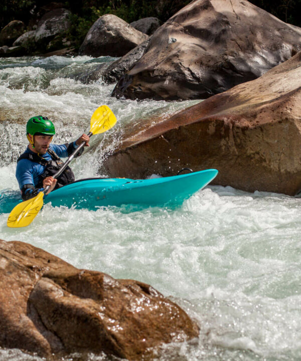 Santiago Canala paddling in the river. Napo, Ecuador.