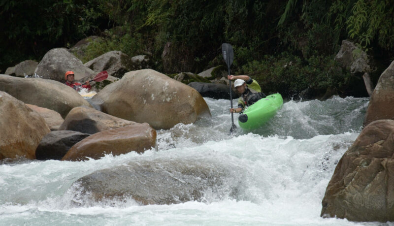 Kayaking guide descending river