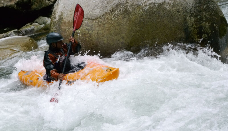 Kayaker maneuvering rapids in Ecuador