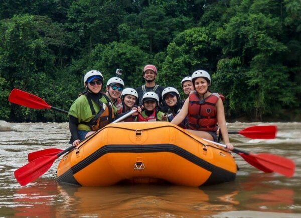 Friends and family in a rafting boat in Anzu river in Southamerica, Ecuador